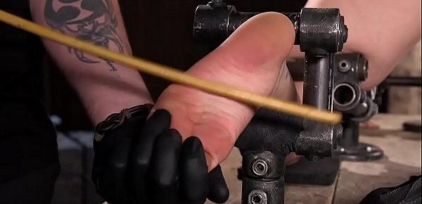  Babe in device bondage caned in doggy